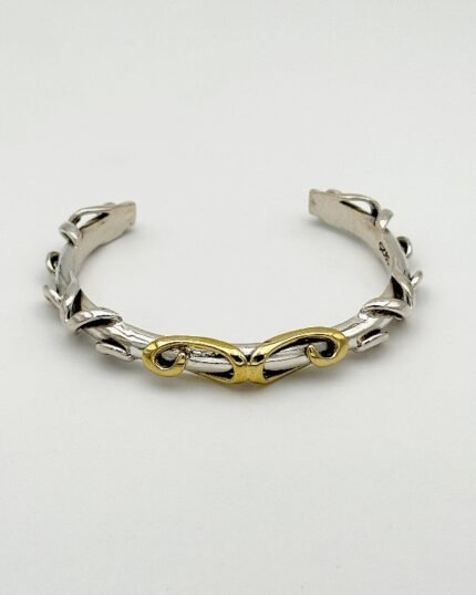 Pulsera plata y latón